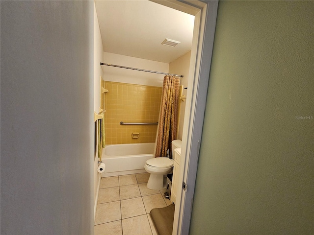 full bathroom with tile floors, toilet, shower / bathtub combination with curtain, and vanity