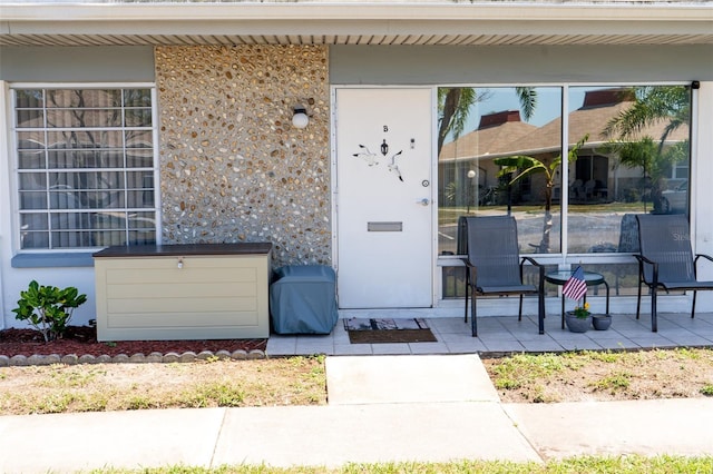 doorway to property with a patio area