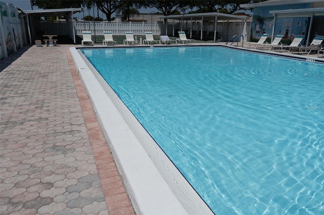 view of swimming pool with a patio area