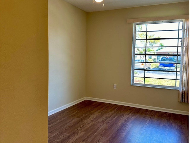 4329 Tahitian Gardens Cir Unit B, Holiday, FL 34691 - unfurnished room featuring dark wood finished floors and baseboards