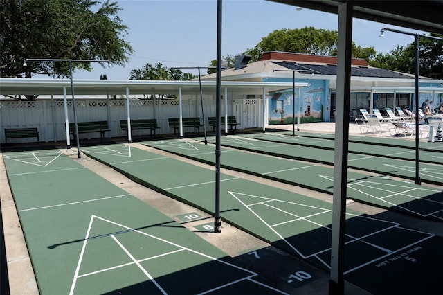 4329 Tahitian Gardens Cir Unit B, Holiday, FL 34691 - view of home's community with fence and shuffleboard