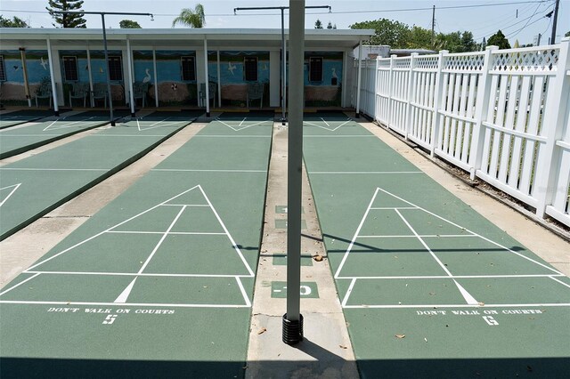 4329 Tahitian Gardens Cir Unit B, Holiday, FL 34691 - surrounding community with fence and shuffleboard