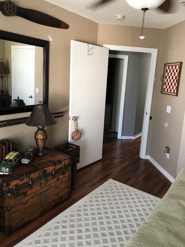 bedroom featuring dark wood-type flooring