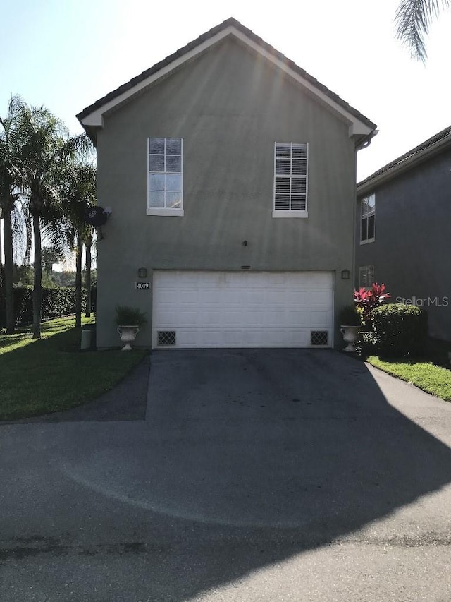 view of property exterior featuring a garage