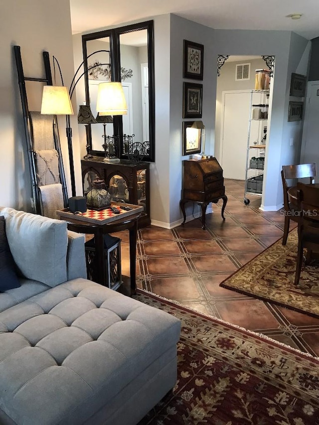 living room with dark tile flooring