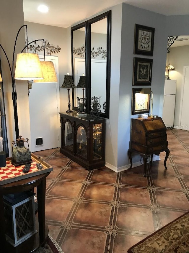 interior space with dark tile flooring