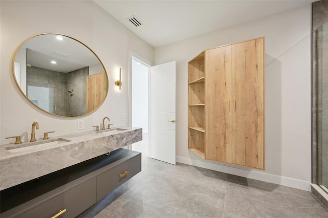 bathroom with vanity and a shower with shower door