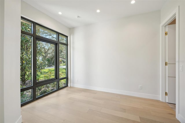 unfurnished room featuring light hardwood / wood-style flooring