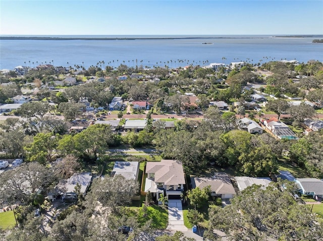 aerial overview of property's location with nearby suburban area and a large body of water