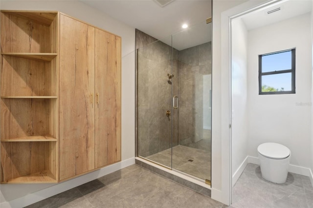 bathroom with toilet and an enclosed shower