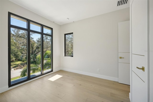 unfurnished room featuring light wood-type flooring