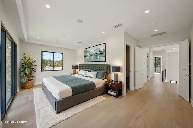 bedroom with light wood-type flooring