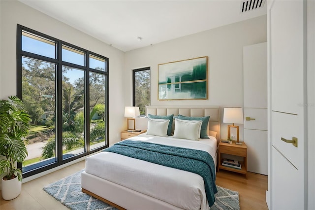 bedroom with light wood-type flooring