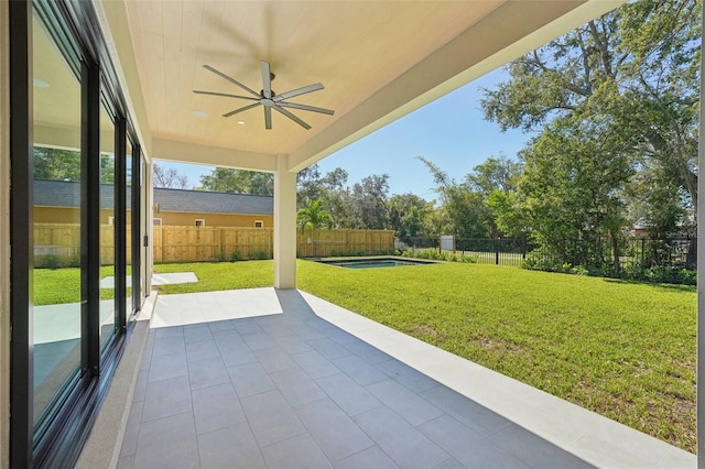 view of patio featuring ceiling fan