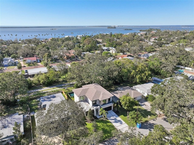 aerial view of property's location featuring nearby suburban area and a nearby body of water