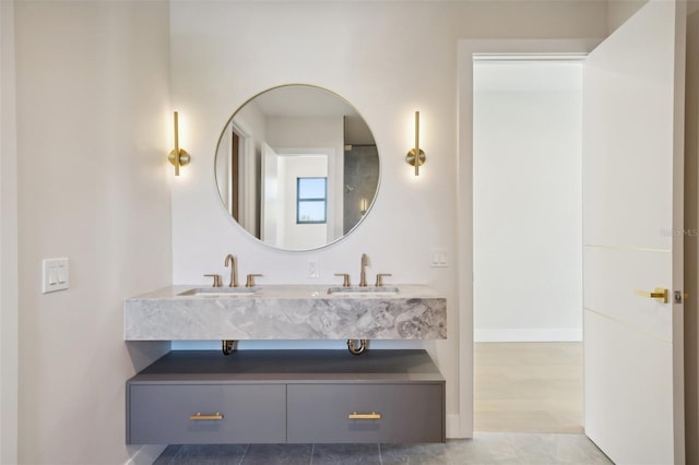 bathroom with tile patterned floors and vanity