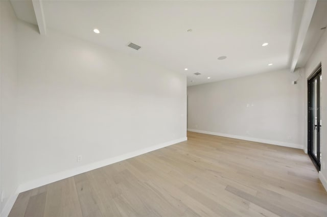 spare room with light hardwood / wood-style flooring