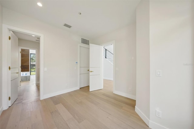 unfurnished bedroom with light hardwood / wood-style flooring