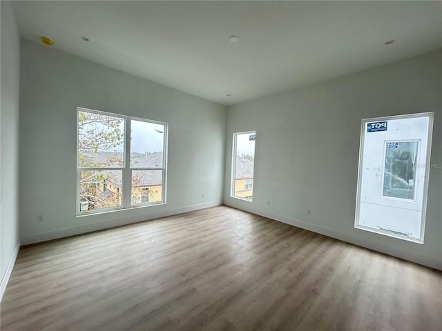 spare room featuring light wood-type flooring