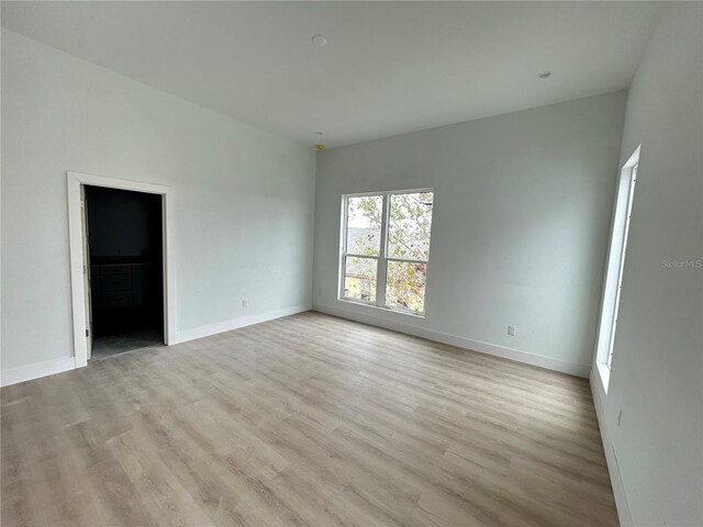 spare room featuring light hardwood / wood-style floors