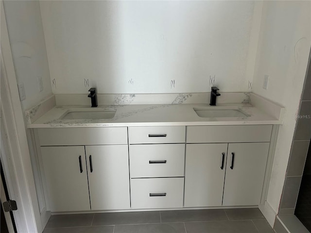 bathroom featuring tile patterned flooring and vanity