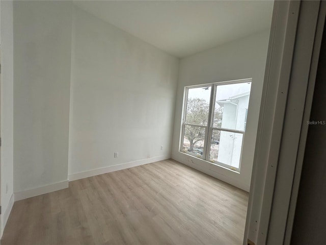 spare room featuring light hardwood / wood-style flooring