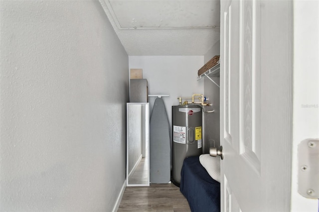 utility room featuring electric water heater