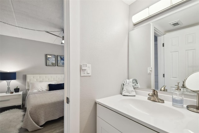 bathroom with vanity with extensive cabinet space