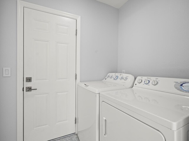 laundry room featuring washing machine and dryer