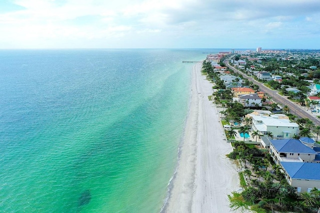 bird's eye view featuring a water view and a view of the beach