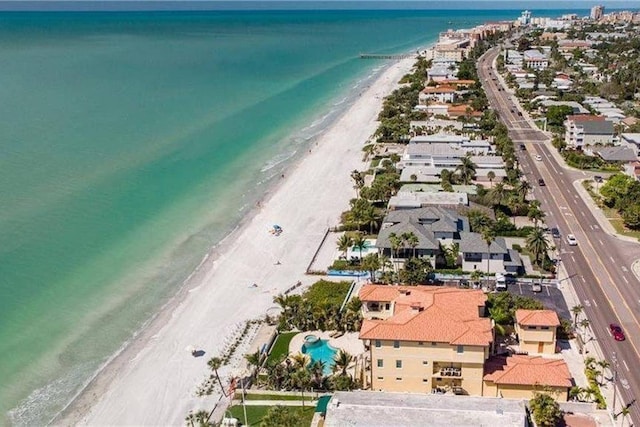 bird's eye view featuring a view of the beach and a water view