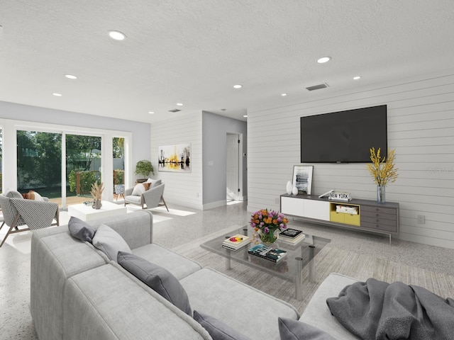 living room with a textured ceiling