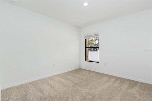 spare room with carpet floors