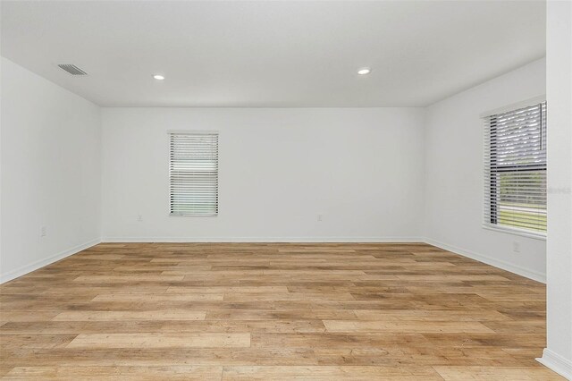 spare room featuring light hardwood / wood-style flooring