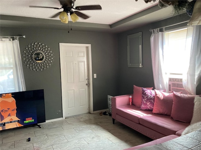 living room with cooling unit and ceiling fan