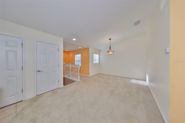 empty room with light colored carpet