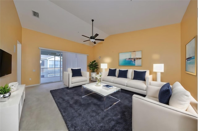 living room with lofted ceiling, light colored carpet, and ceiling fan