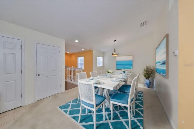 dining space featuring light colored carpet