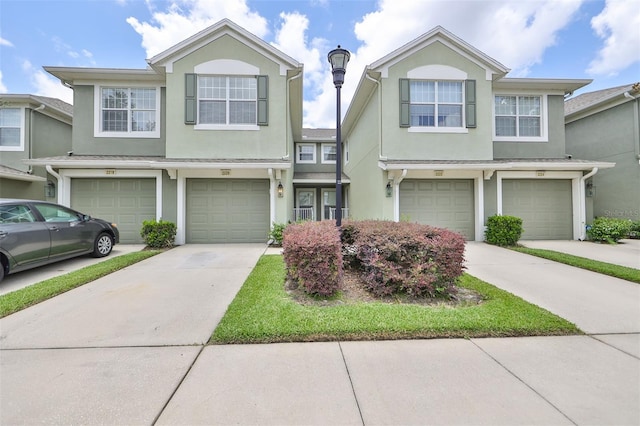 multi unit property featuring a garage