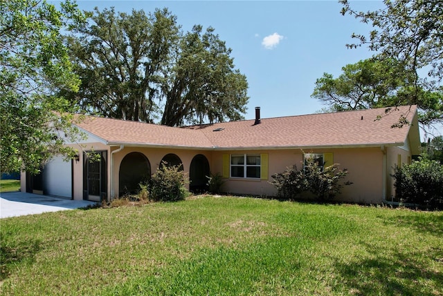 ranch-style house with a front lawn and a garage