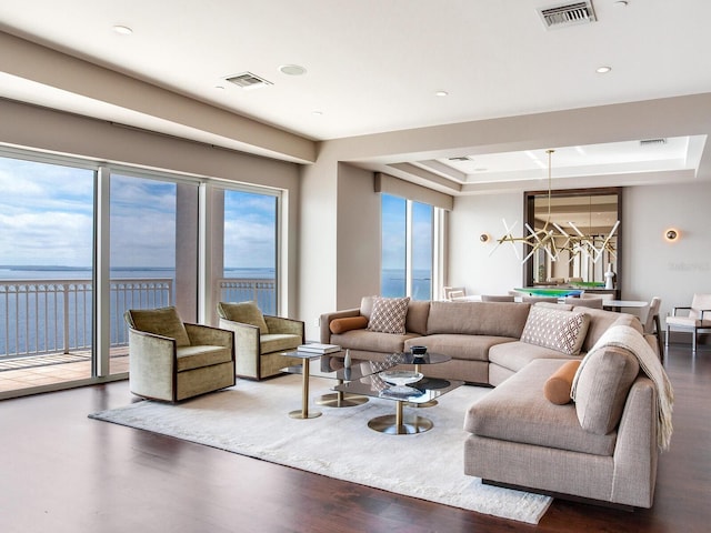 living room with pool table, a healthy amount of sunlight, and visible vents