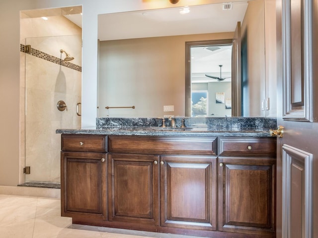 full bathroom with a shower stall and vanity