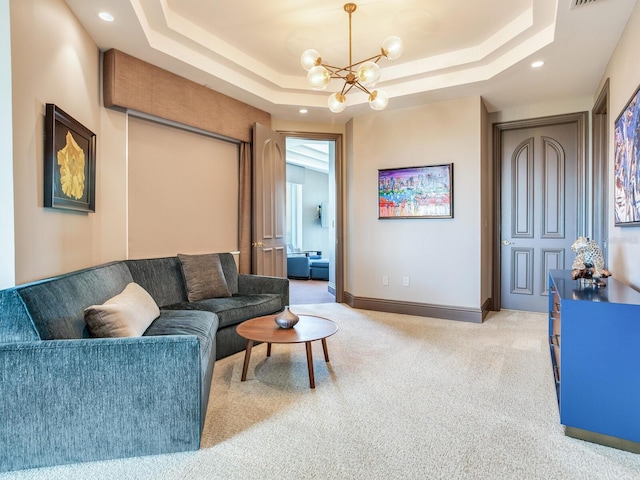 living area with a tray ceiling, recessed lighting, light colored carpet, a chandelier, and baseboards