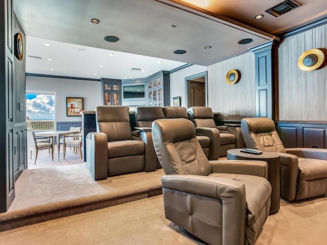 cinema room featuring ornamental molding, recessed lighting, light carpet, and visible vents