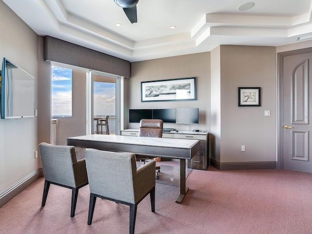 office featuring light carpet, baseboards, a tray ceiling, and recessed lighting