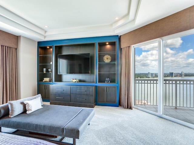 living room featuring a tray ceiling, carpet flooring, and recessed lighting