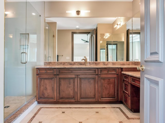 full bath featuring a shower stall and vanity