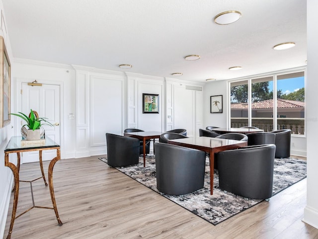 dining area featuring light wood-style flooring