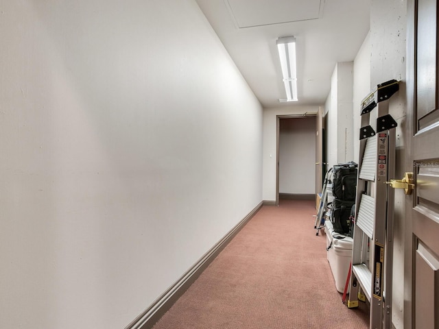 hall featuring light carpet and baseboards