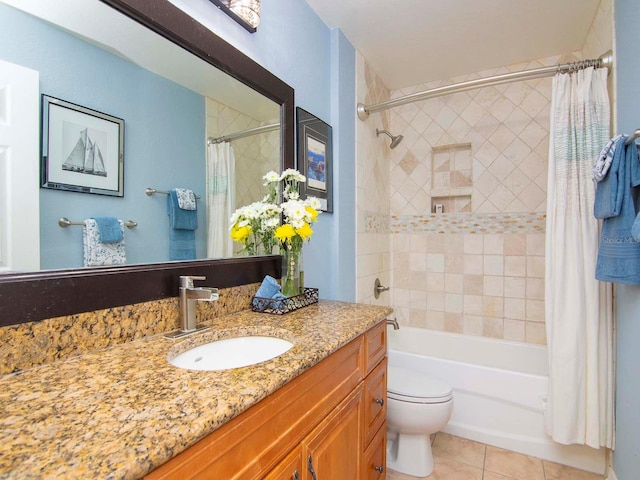 full bathroom with shower / bath combo with shower curtain, toilet, tile floors, and vanity